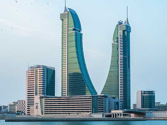 waterfront view of Bahrain Financial Harbour, with its distinctive twin towers rising gracefully against the skyline—home to Servcorp serviced offices