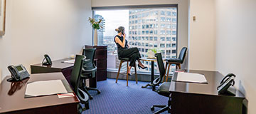 Servcorp client in a serviced office at 10 Avenue Kléber enjoying the premium workspace and stunning city views.
