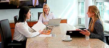 Servcorp clients connecting in a meeting room at 10 Avenue Kléber, supported by a premium business environment and services.