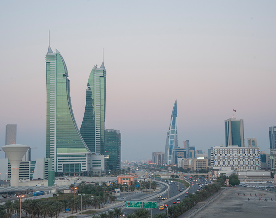 A panoramic view of Bahrain Financial Harbour at dusk, with its distinctive twin towers standing prominently along the Manama skyline—home to Servcorp serviced offices