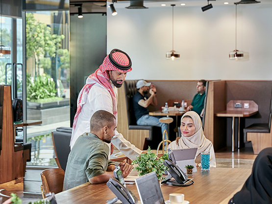 At Servcorp Abu Ouf Plaza in Madinah, professionals collaborate in a contemporary coworking space, designed to foster interaction, focus, and business growth.
